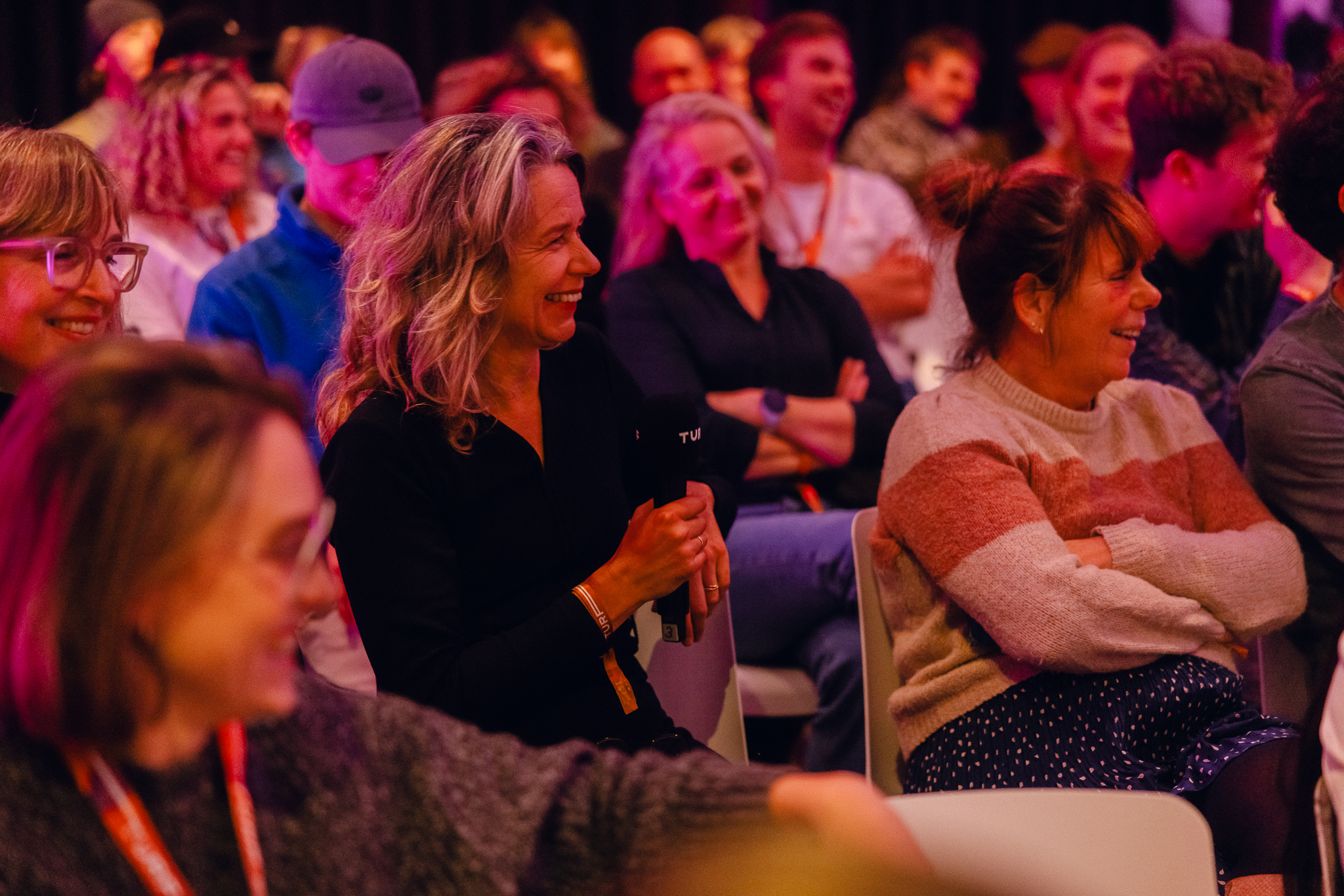 Women sitting in an audience listening to a talk at TURF